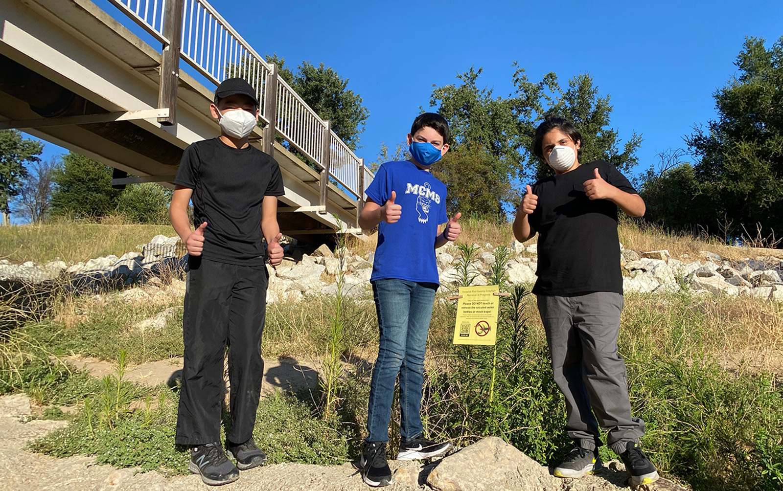 OurEcho Challenge First place Team Crayfish working to remove an invasive species of crayfish from a local creek.