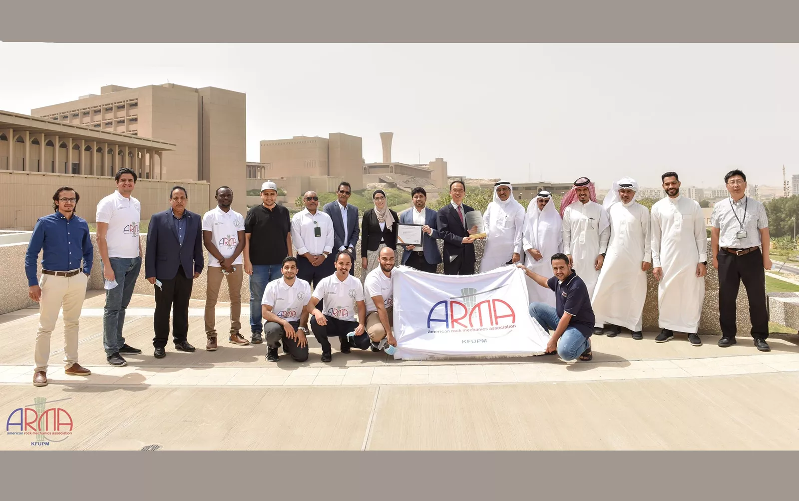 American Rock Mechanics Association President Gang Han with representatives from King Fahd University of Petroleum and Minerals (KFUPM) University.